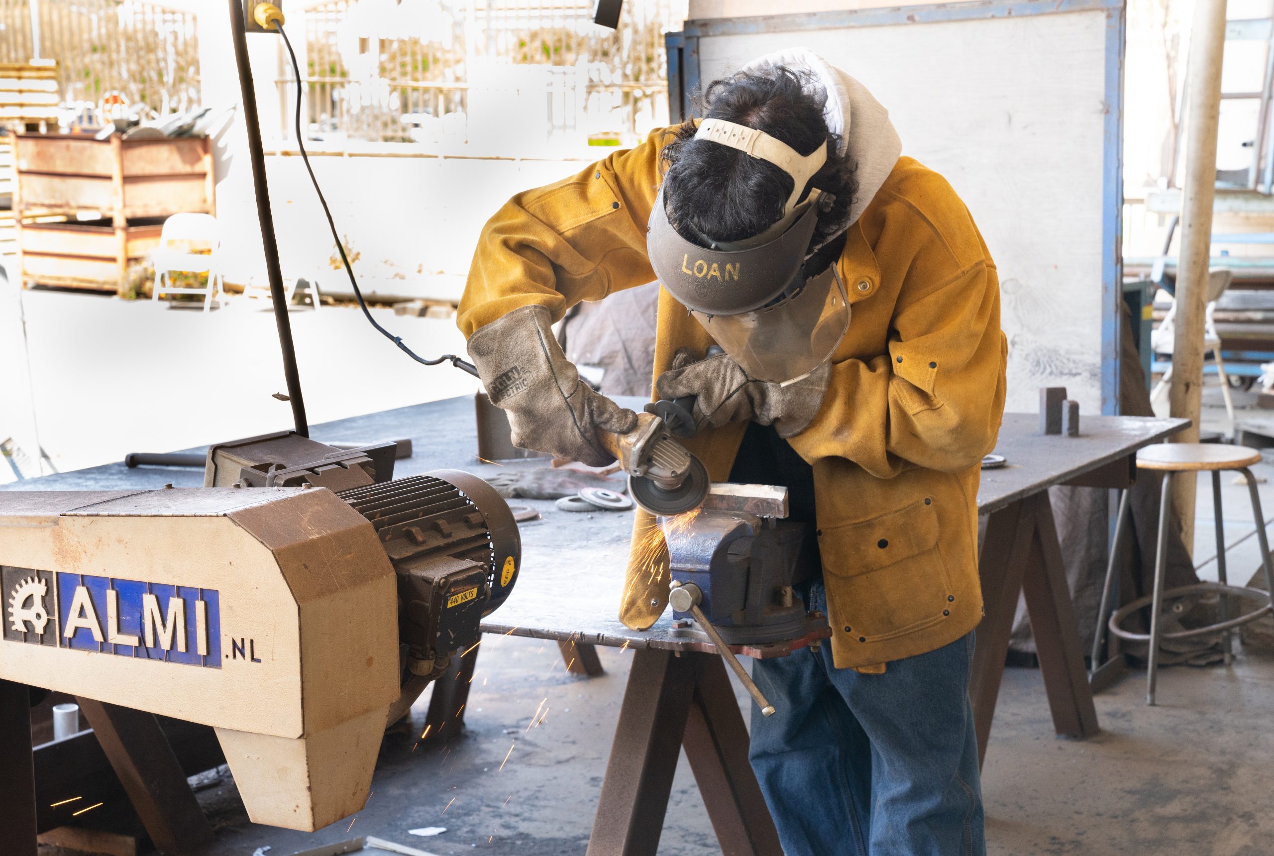 Fullerton College Welding student utilizing welding equipment.